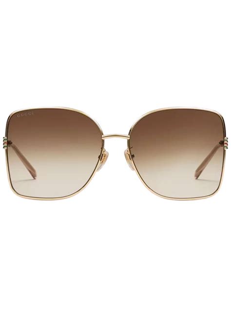 see through sunglasses gucci|Geometric frame sunglasses in gold.